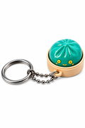 Keychain with a green cactus-shaped keyring on a white background