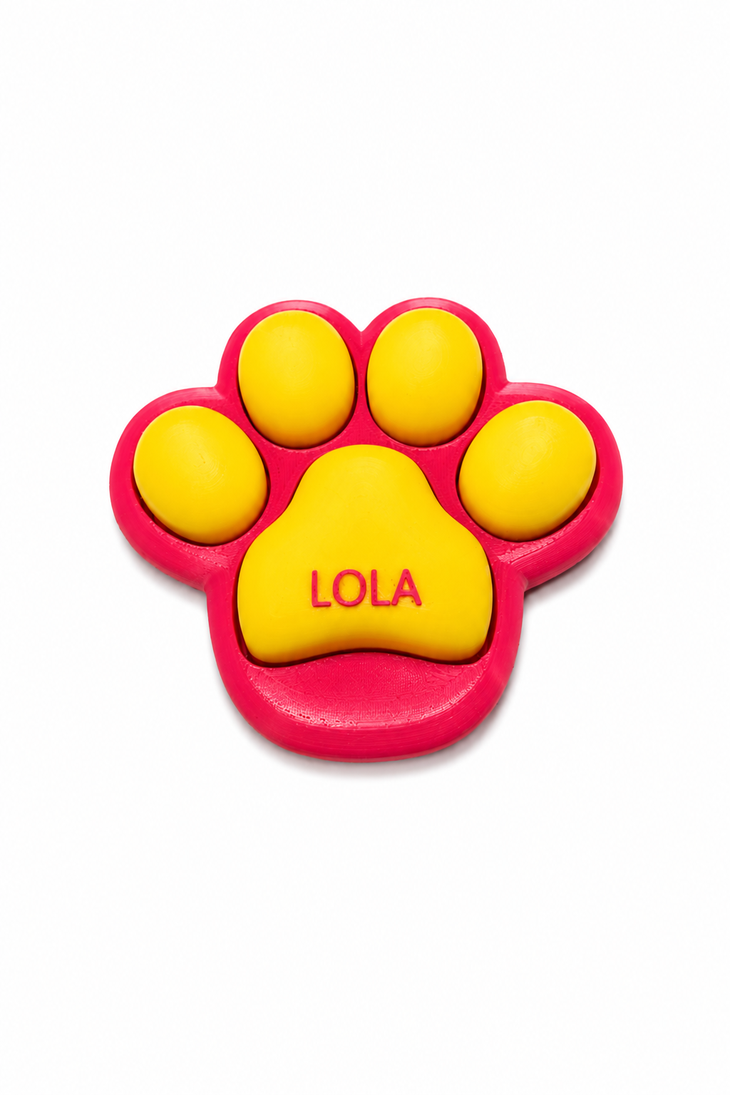 Pink and yellow paw-shaped toy with 'LOLA' on a white background